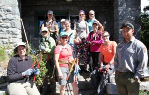 The crew poses holding their tools