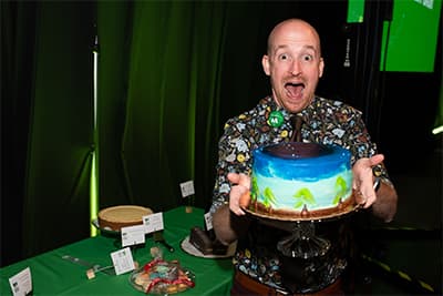 Participant in the dessert dash shows off his cake