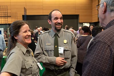 Park Service staff laugh during Auction dinner