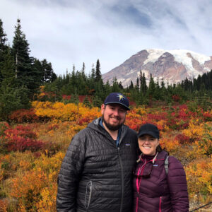 The couple in front of Mount Rainier in the fall