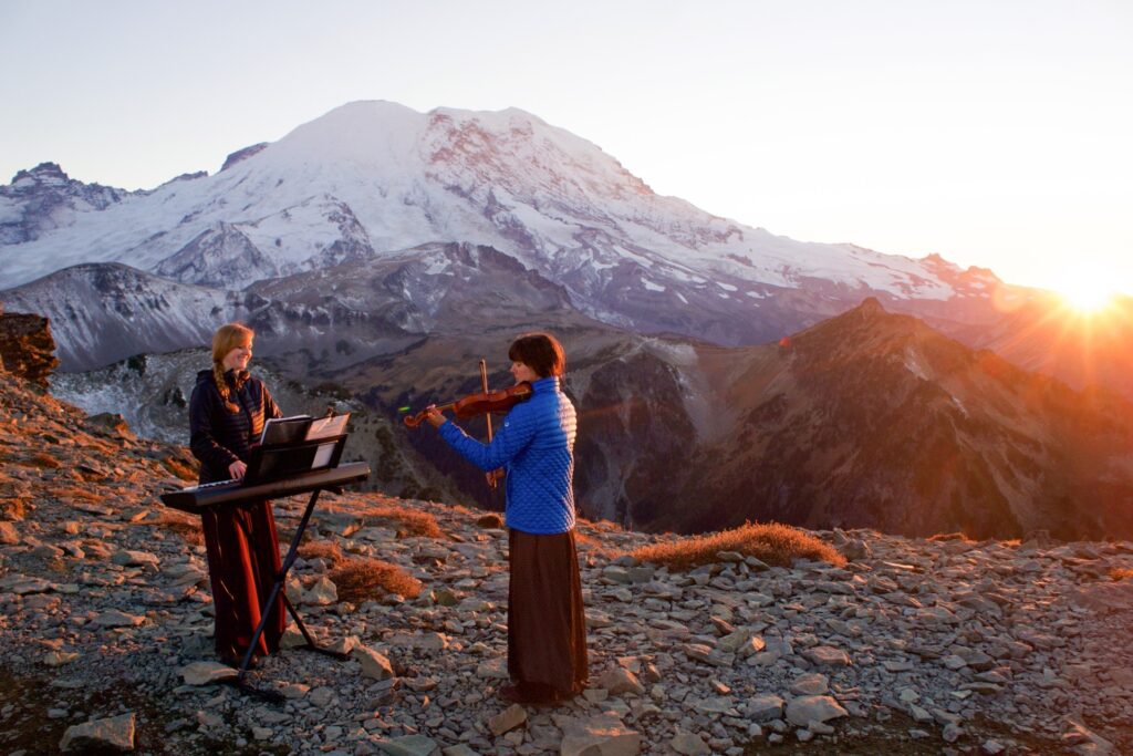 The musical mountaineers perform in front of Mount Rainier