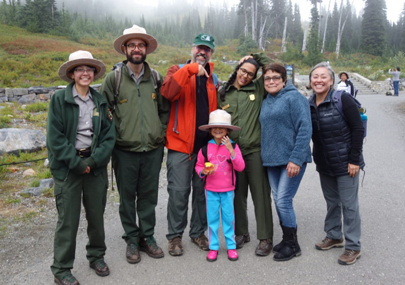 Antonio, along with WNPF staff, poses with rangers and Casa Latina participants on their visit to Mount Rainier, made possible by a joint effort between Casa Latina, WNPF, and Mount Rainier National Park