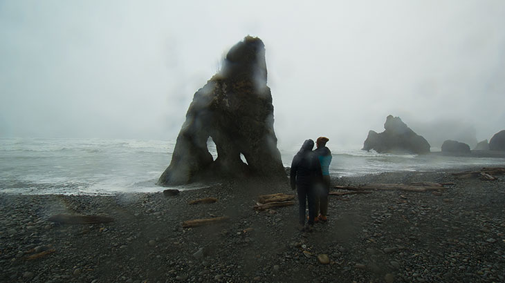 Park visitors experience Ruby Beach in the rain
