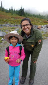 A ranger poses with a park visitor
