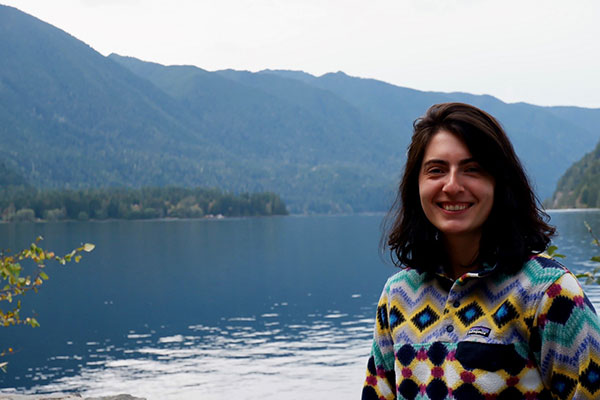 Brianna poses in front of Lake Crescent