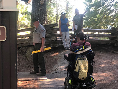 A photo of a person in a wheelchair explores the trails on Mount Rainier National Park.