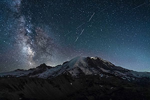 The Milky Way shines above Mount Rainier