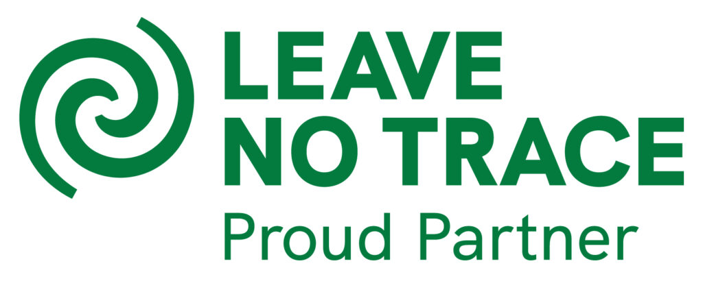 A circular logo with text reading "Leave No Trace Proud Partner" 