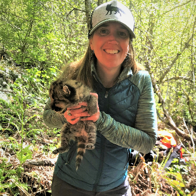 Woman holding a baby cougar.
