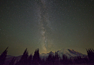 A night sky photo of the milky way with Mount Rainier