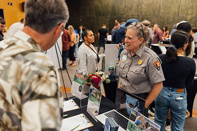 A ranger speaks with attendees